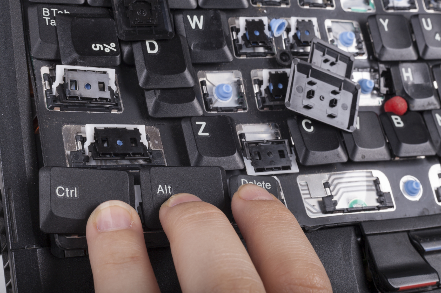 Fingers on alt crtl delete keys on broken laptop keyboard